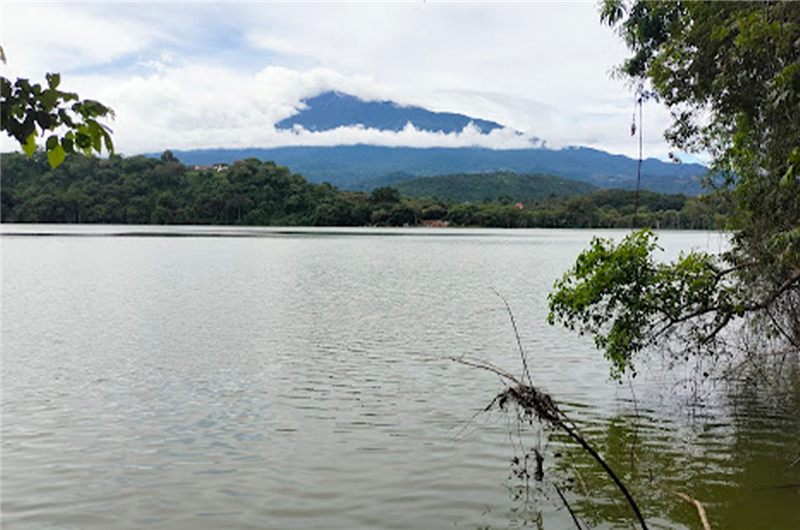 Lake Duluti near Arusha with forested shores and Mount Meru beyond